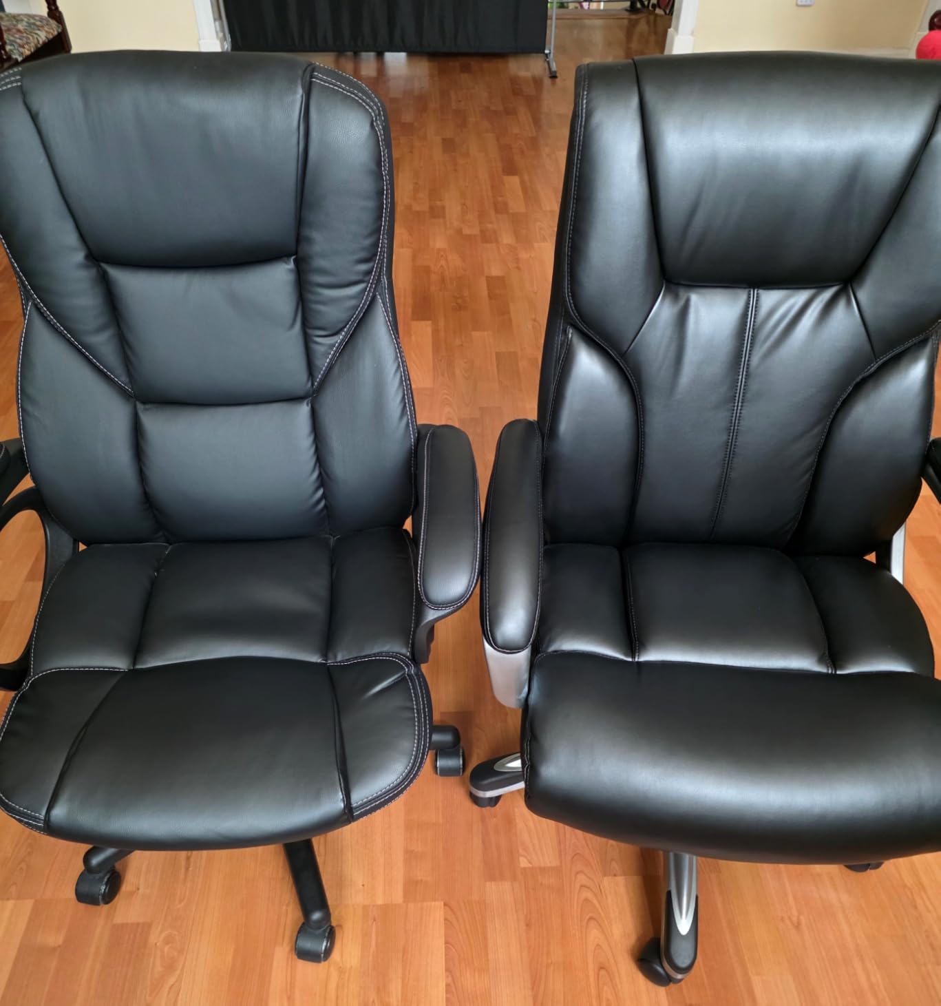 Amazon Basics Executive High Back Office Chair, Adjustable Height, Tilt, Swivel, Padded Seat, Bonded Leather, Wheels, Black/Silver customer photo 1