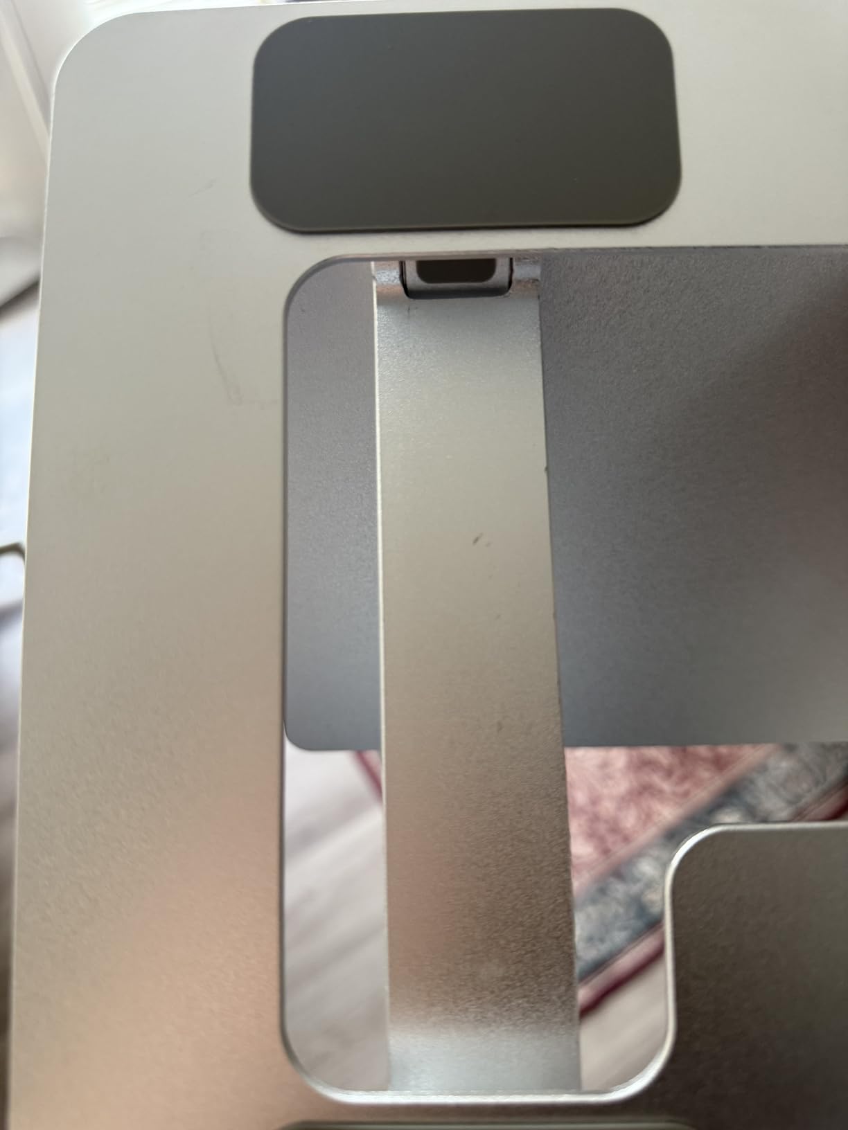 Amazon Basics Sturdy and Portable Ergonomic Laptop Stand for Desk, Height Adjustable Riser with Ventilated Cooling, Foldable, Fits all Laptops up to 15.6 Inch, Silver customer photo 1