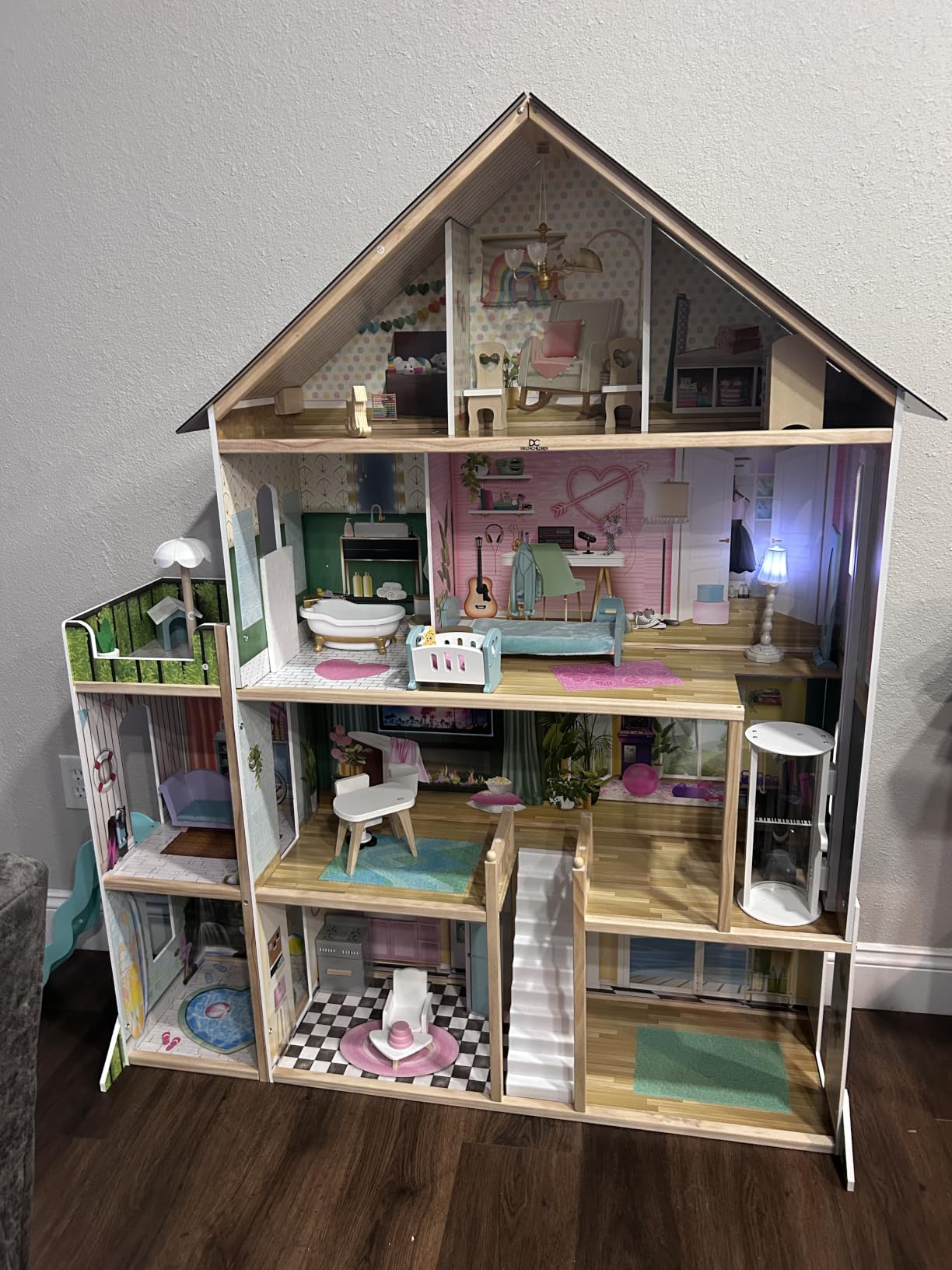 Delta Children Deluxe Maui Dollhouse - Large 4-Story Dollhouse with 12 Rooms Includes 50 Accessories - Working Elevator, Wave Slide, Lights/Sounds - Fits 12-inch Dolls - Pretend Play Gift for Ages 3+ customer photo 1