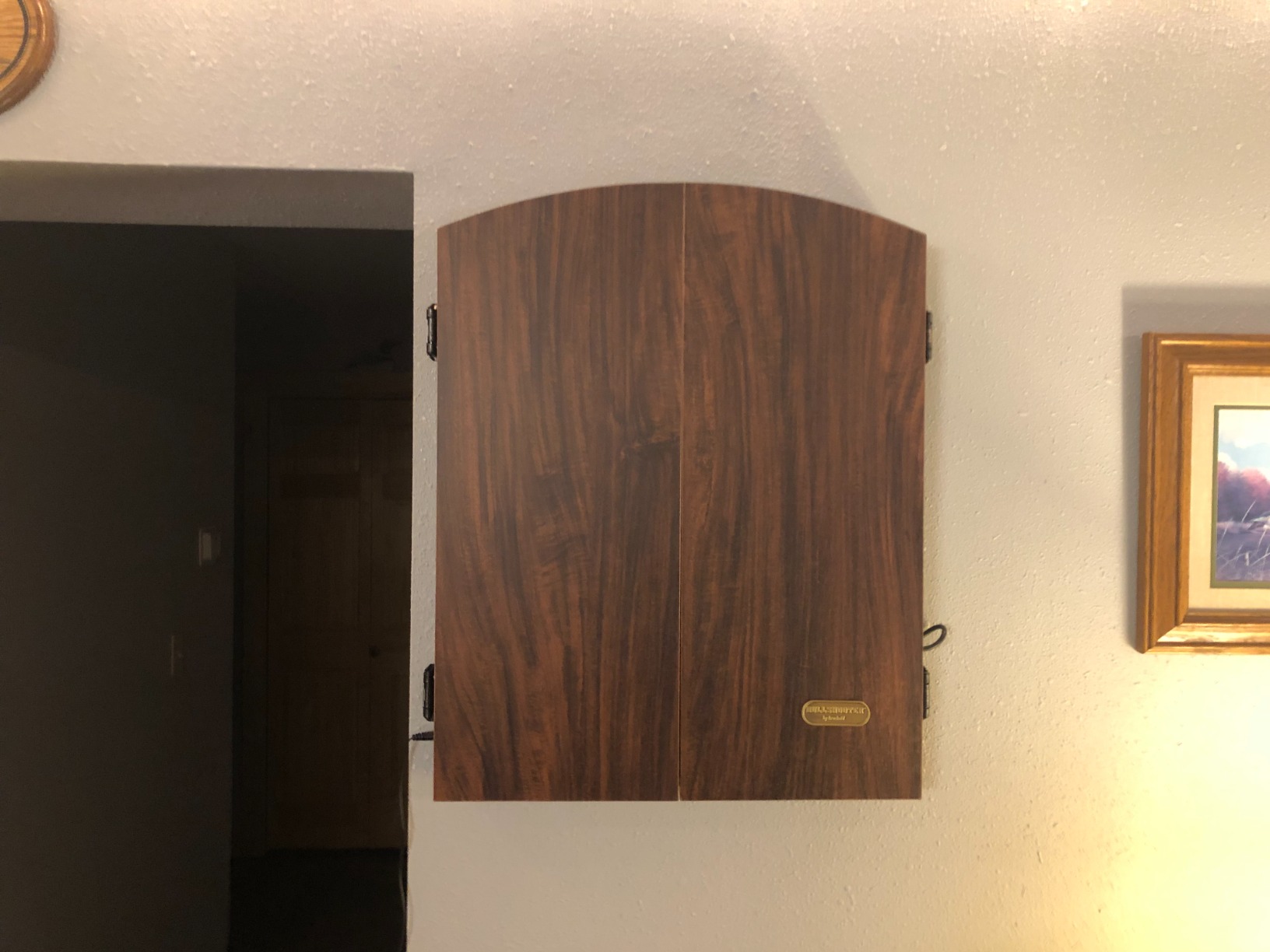 Arachnid CricketMaxx 1.0: 13.5” recreation size with wood cabinet. Features 34 games, 183 variations, 8-player LED X/O scoring, and Heckler mode. Integrated storage for darts and accessories customer photo 2